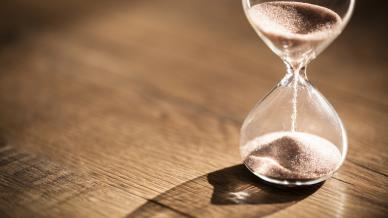 Hour glass with sand running out